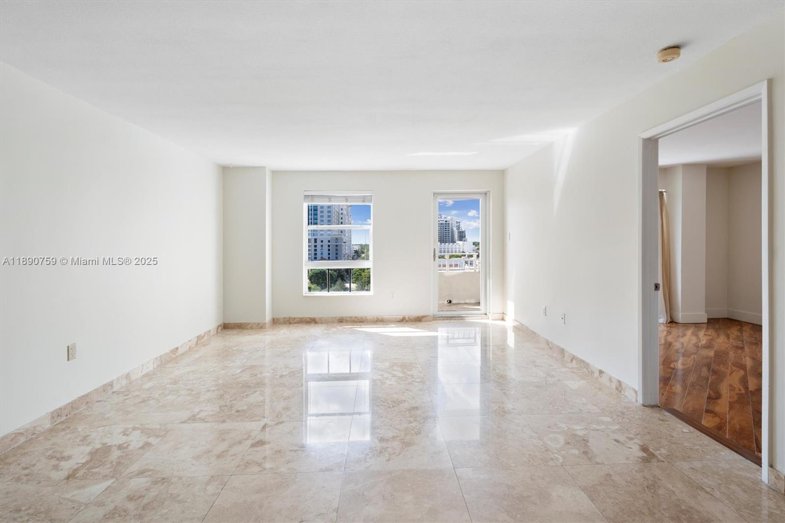 2351 Douglas Road, Unit 906 Miami, FL 33145 - Photo 19 of 45 an empty room with windows
