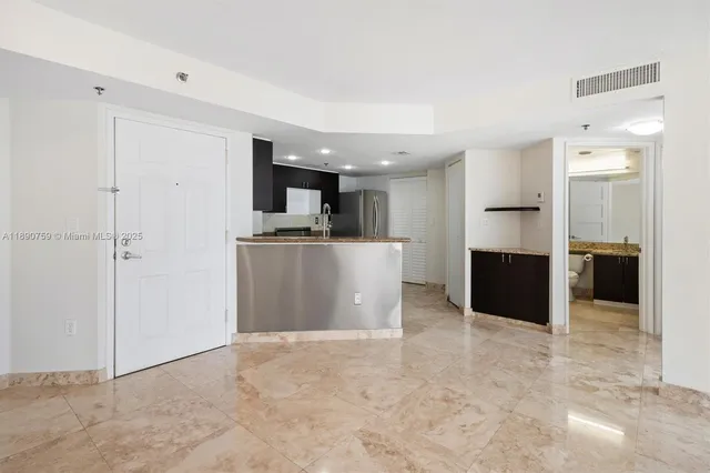 a view of a kitchen with a sink