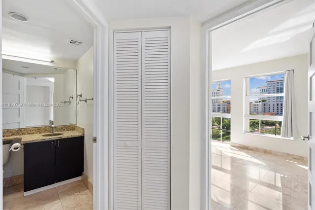 a view of a kitchen with a sink and cabinets