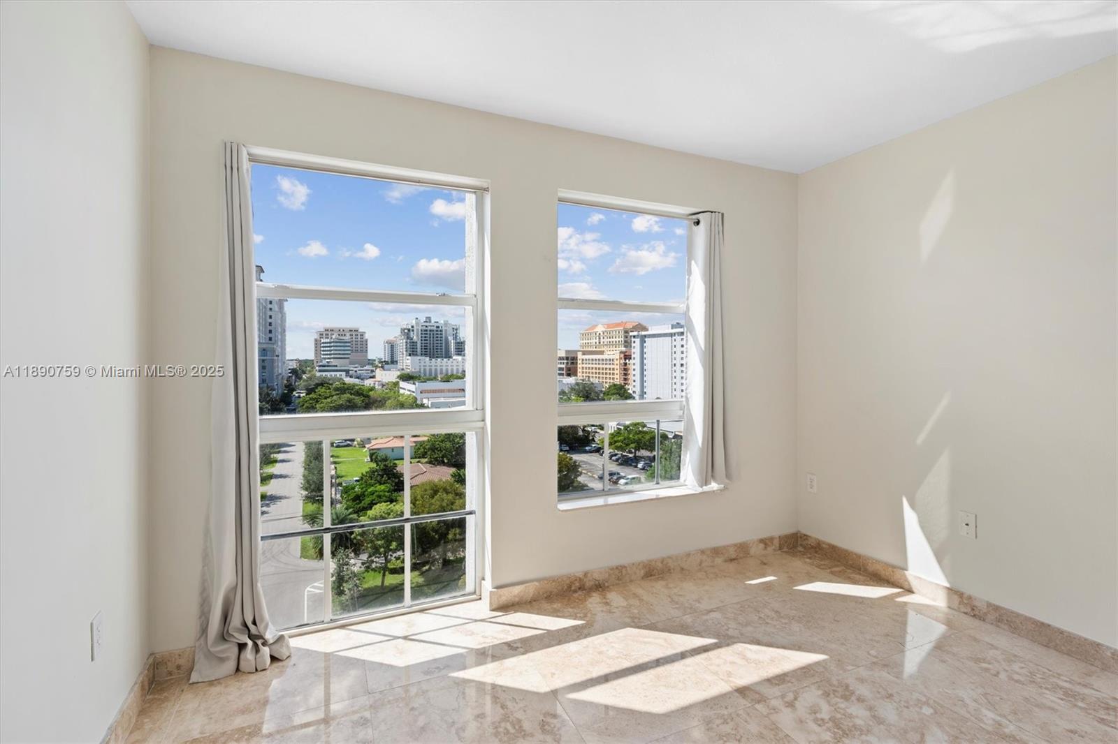 2351 Douglas Road, Unit 906 Miami, FL 33145 - Photo 33 of 45 a view of a room that has a bed and a window