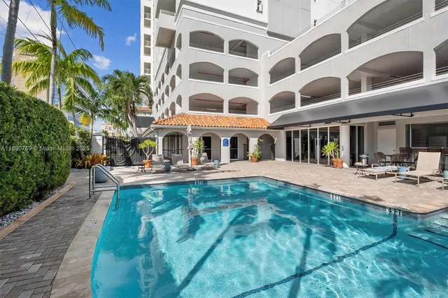 a view of a building with a yard