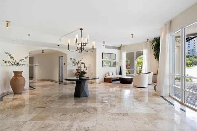 a view of a livingroom with furniture and windows