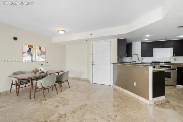a kitchen with a table and chairs in it