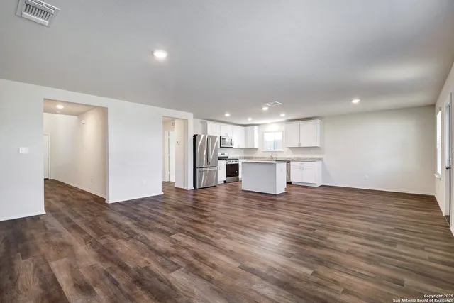 a view of kitchen with wooden floor