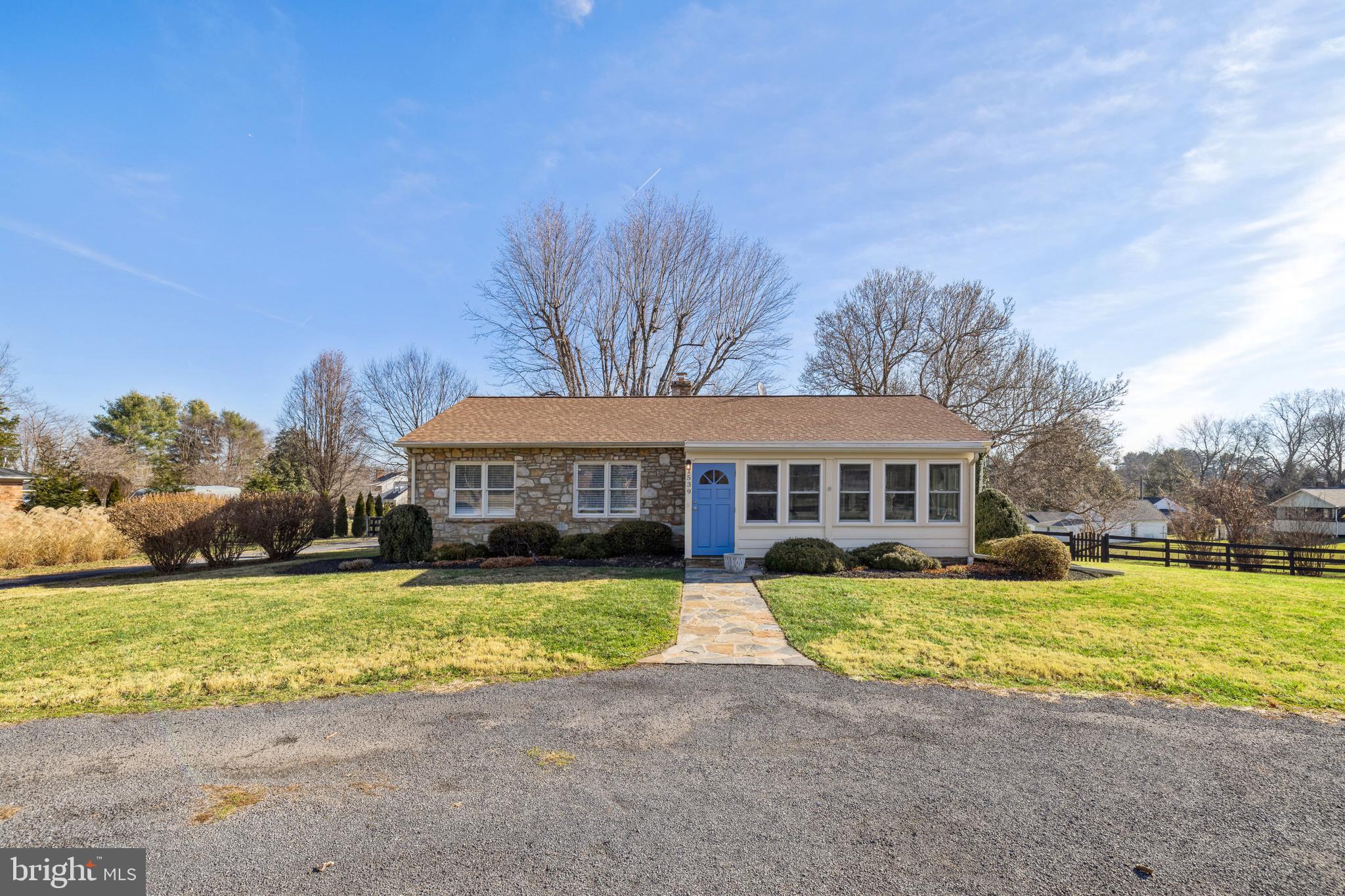 a view of a house with swimming pool and a yard