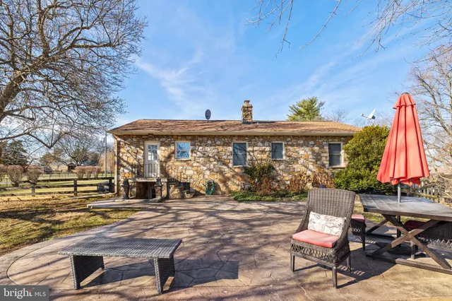 a view of a chairs and table in the patio