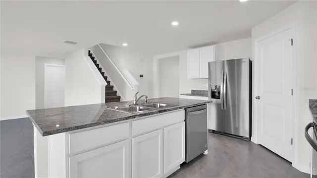 a kitchen with sink and window