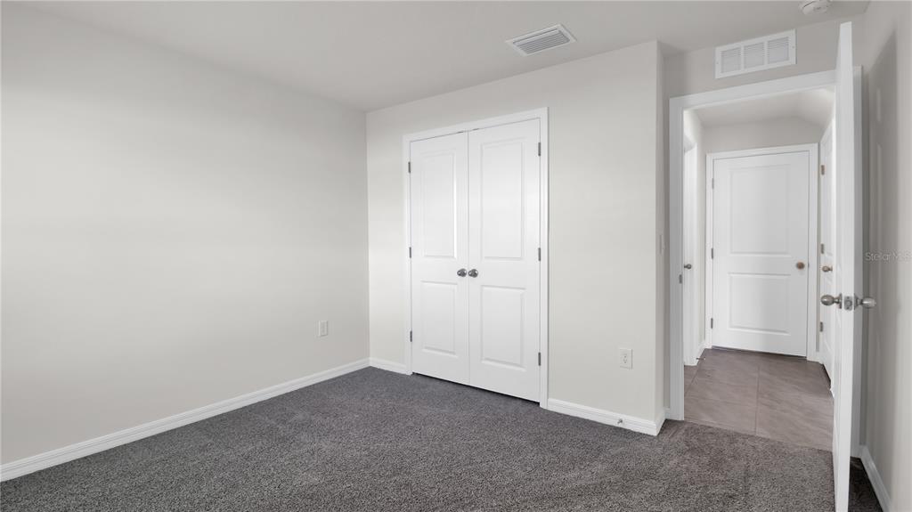 16632 Windmill Forge Pass Wimauma, FL 33598 - Photo 24 of 40 a view of an empty room