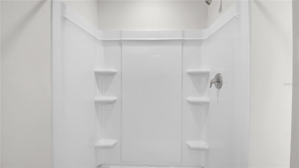 16632 Windmill Forge Pass Wimauma, FL 33598 - Photo 31 of 40 a bathroom with a shower
