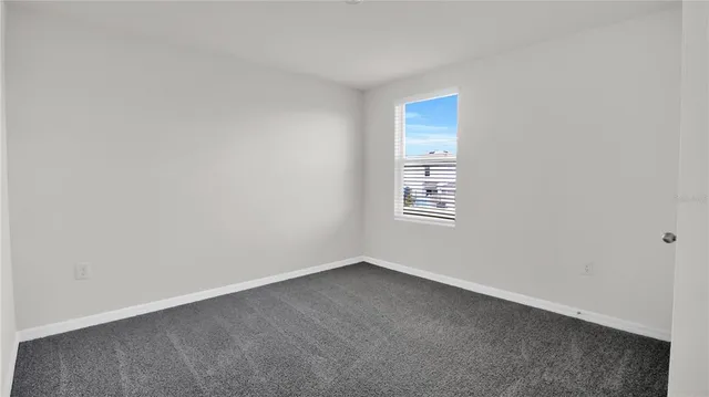 a view of a room that has a window in it