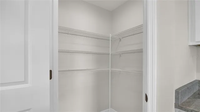 a walk in closet with a shower