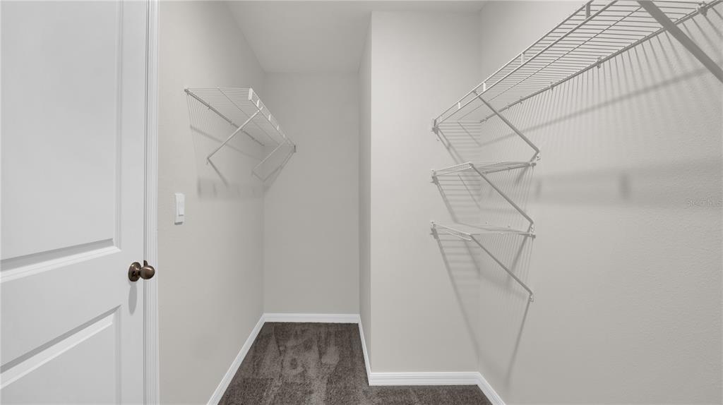 16632 Windmill Forge Pass Wimauma, FL 33598 - Photo 7 of 40 a view of small space with racks on the wall