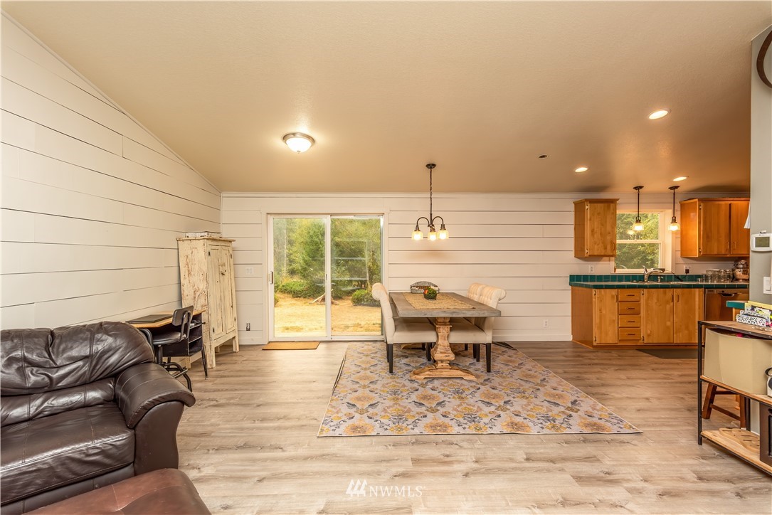 517 South Military Road Winlock, WA 98596 - Photo 8 of 31 a living room with couches chairs kitchen view and kitchen view