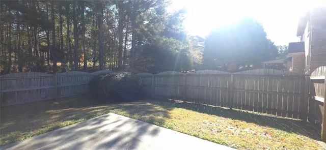 a view of backyard and tree