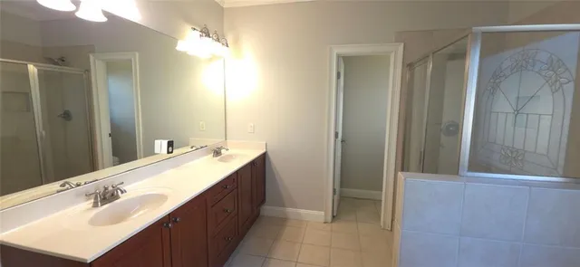 a bathroom with a double vanity sink mirror and double