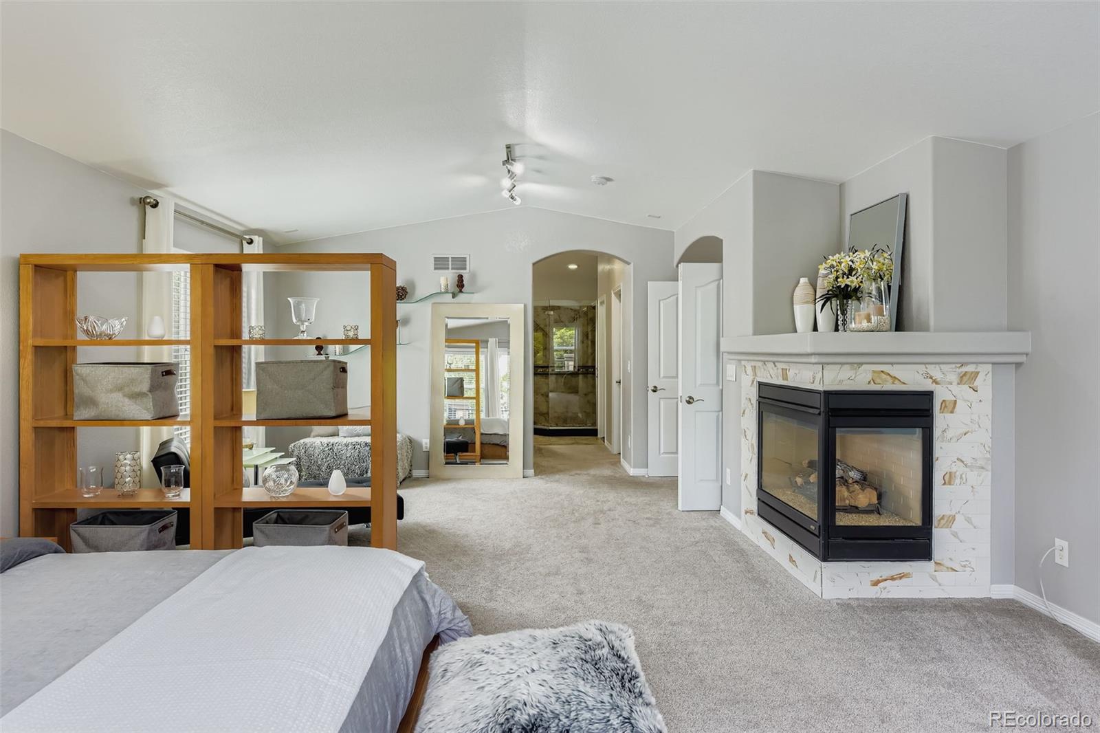 795 Ridgemont Circle Highlands Ranch, CO 80126 - Photo 14 of 35 a living room with furniture large window and fireplace