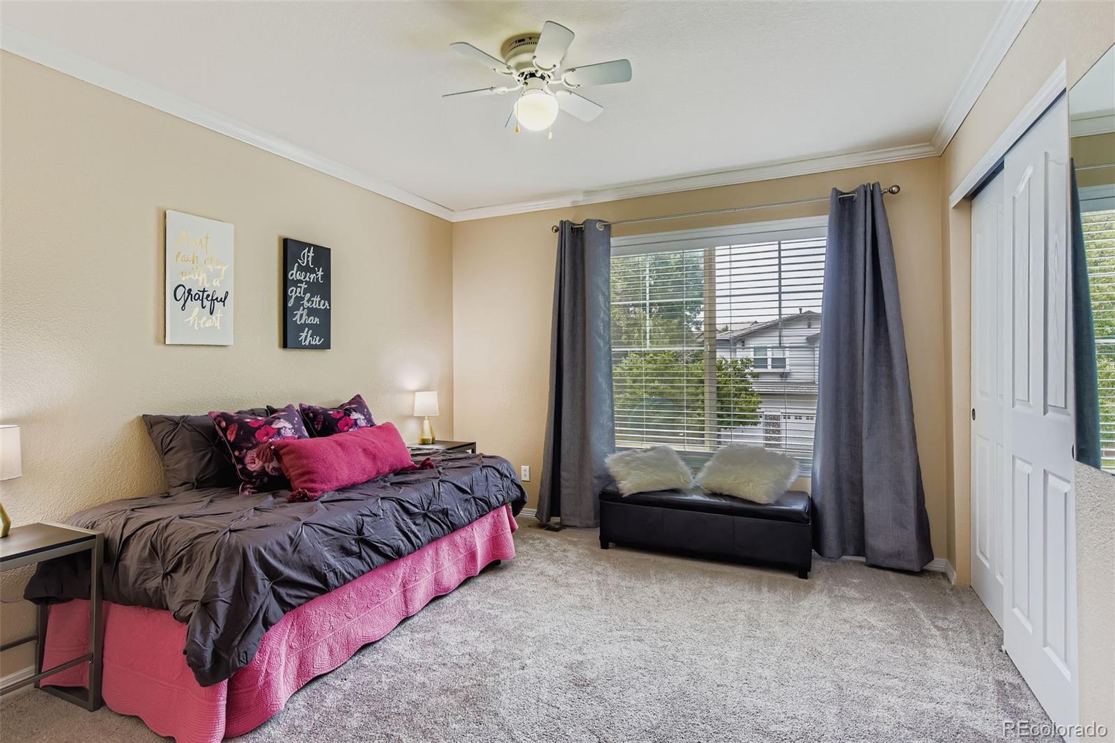 795 Ridgemont Circle Highlands Ranch, CO 80126 - Photo 19 of 35 a living room with a bed and a window