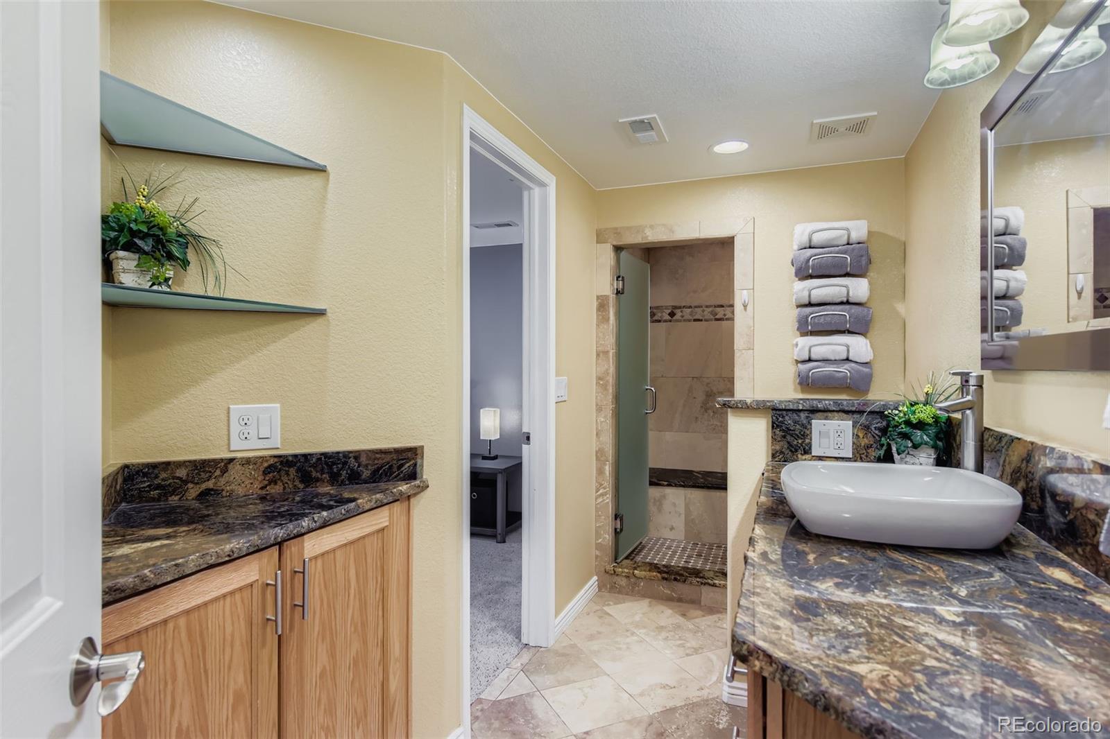 795 Ridgemont Circle Highlands Ranch, CO 80126 - Photo 24 of 35 a living room with furniture and a fireplace