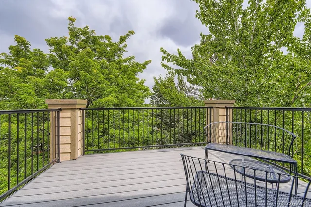 a view of a balcony with wooden floor