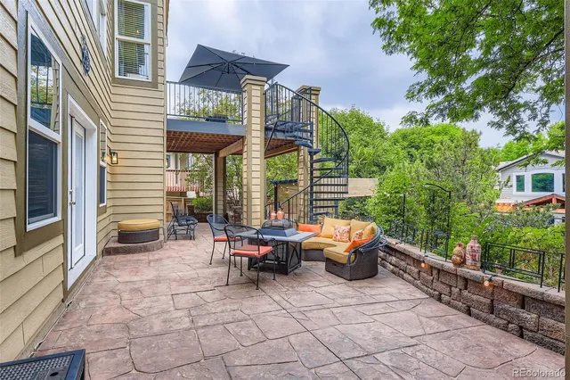 a view of a two chairs in the balcony
