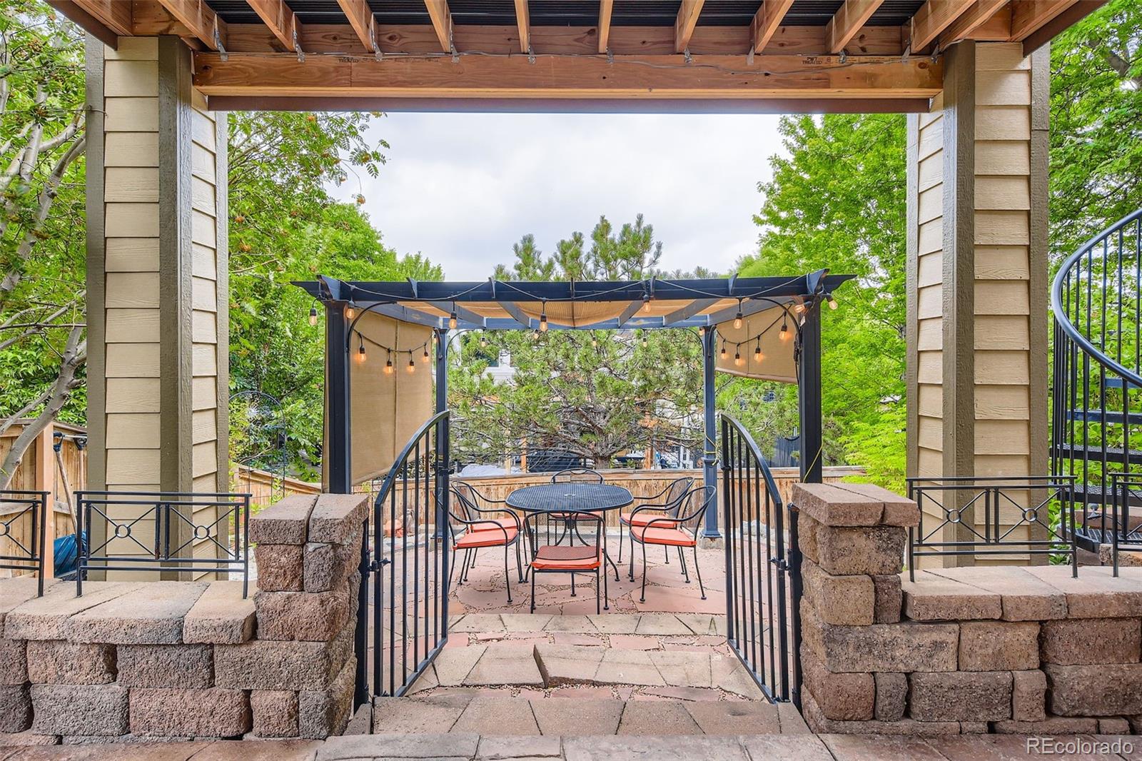 795 Ridgemont Circle Highlands Ranch, CO 80126 - Photo 30 of 35 a view of a porch with a table and chairs