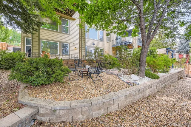 a view of a patio with a chairs and table in a patio
