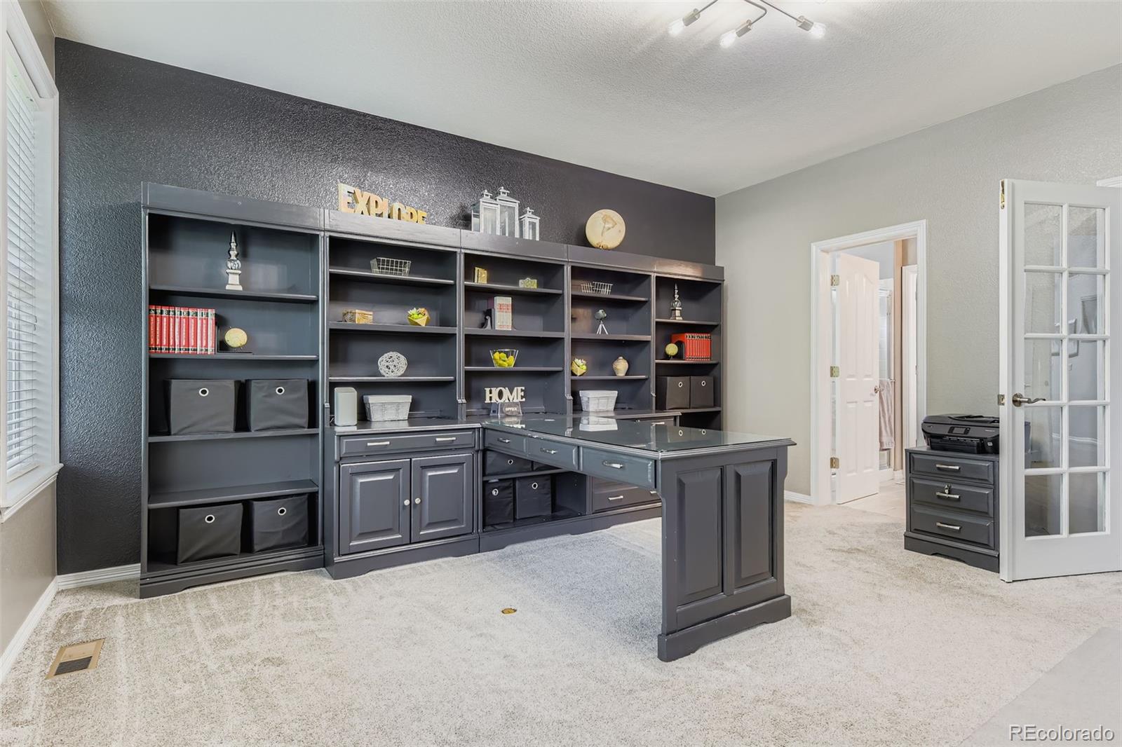 795 Ridgemont Circle Highlands Ranch, CO 80126 - Photo 7 of 35 a kitchen with stainless steel appliances cabinets and window