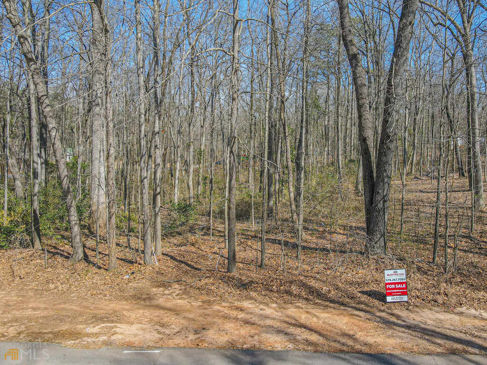 a signage on a wall next to a road