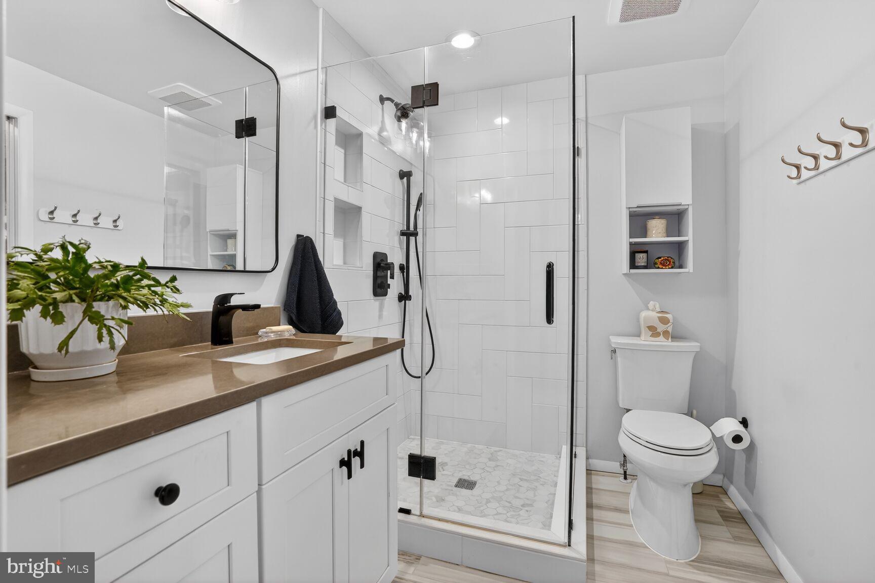 1575 Bennington Woods Court Reston, VA 20194 - Photo 20 of 39 a bathroom with a sink a toilet and shower