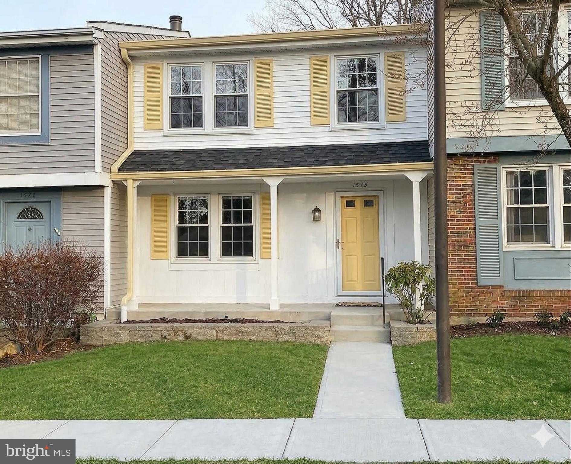 1575 Bennington Woods Court Reston, VA 20194 - Photo 2 of 39 a front view of a house with a yard