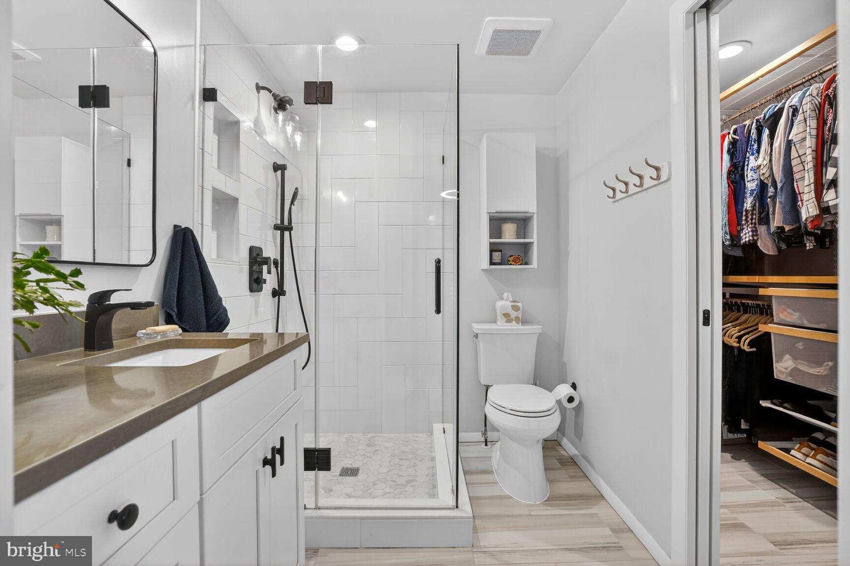 1575 Bennington Woods Court Reston, VA 20194 - Photo 21 of 39 a bathroom with a sink a toilet and shower