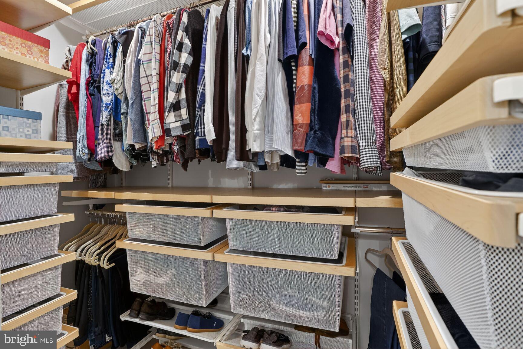 1575 Bennington Woods Court Reston, VA 20194 - Photo 22 of 39 a view of walk in closet with clothes and shoes