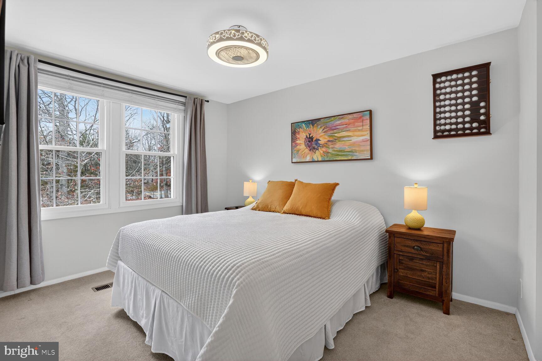 1575 Bennington Woods Court Reston, VA 20194 - Photo 25 of 39 a bedroom with bed and a window