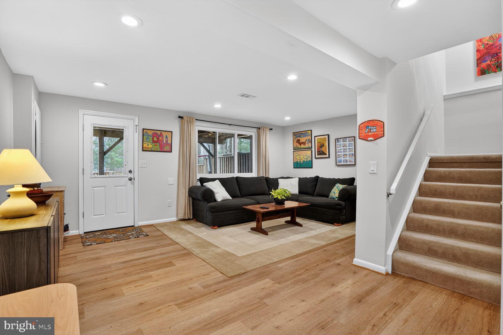 1575 Bennington Woods Court Reston, VA 20194 - Photo 26 of 39 a living room with furniture and wooden floor