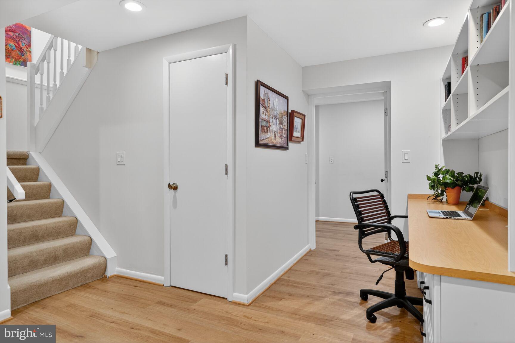 1575 Bennington Woods Court Reston, VA 20194 - Photo 29 of 39 a view of a hallway with workspace and wooden floor
