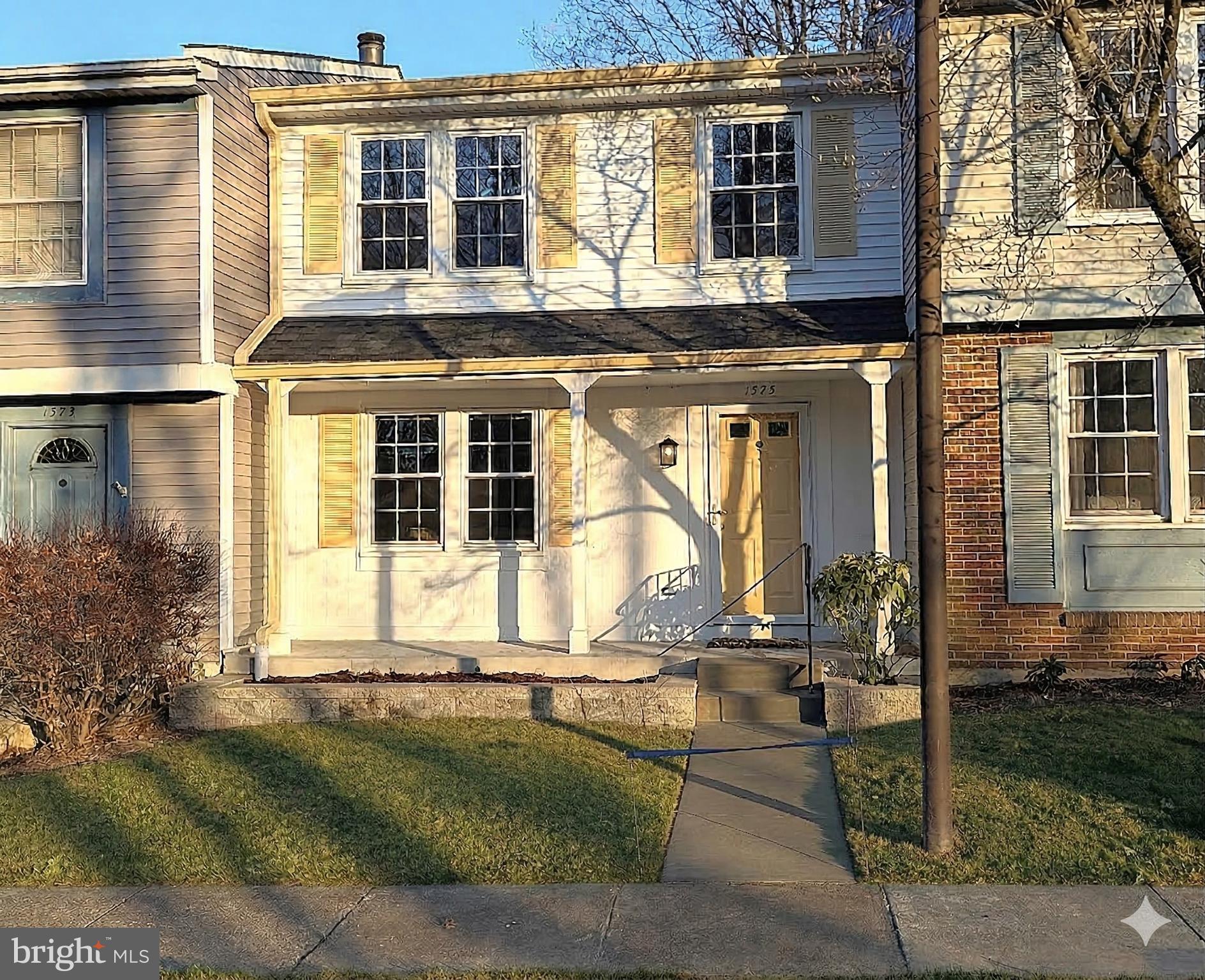 1575 Bennington Woods Court Reston, VA 20194 - Photo 35 of 39 a front view of a house with a yard