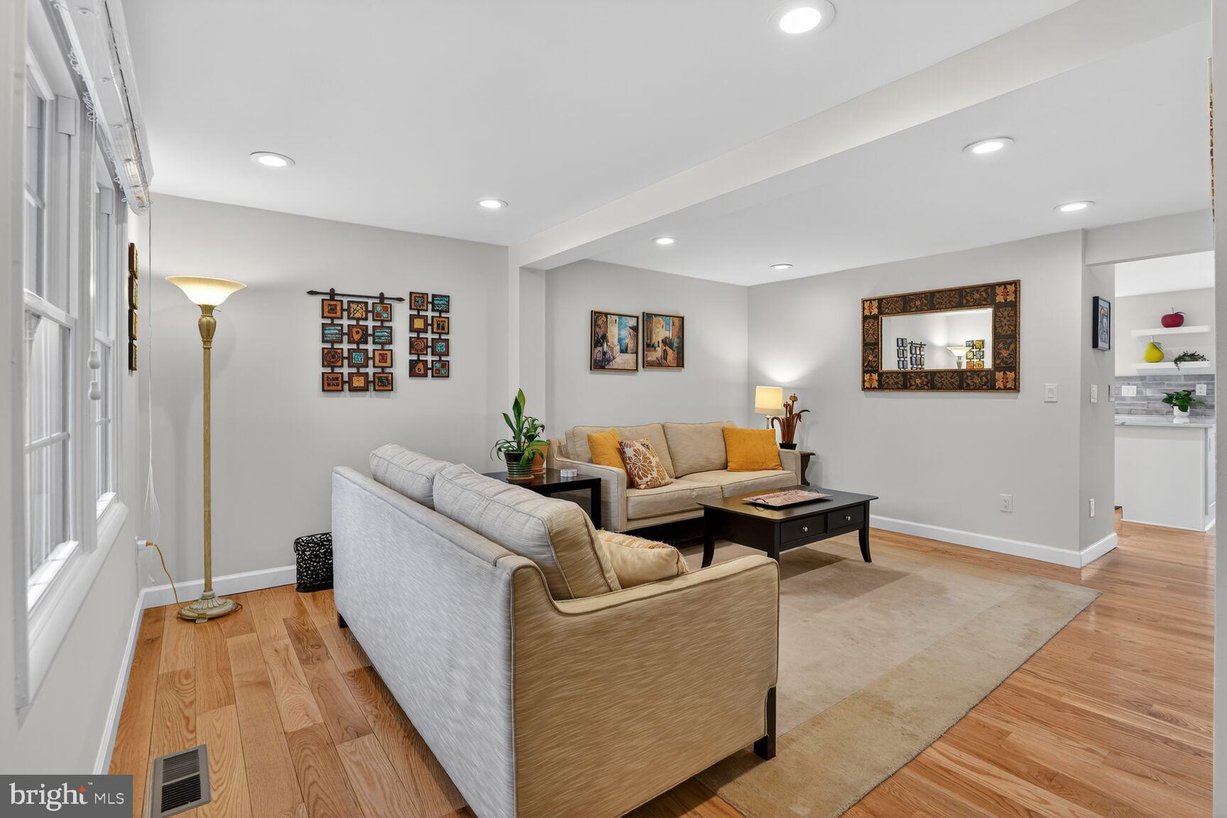 1575 Bennington Woods Court Reston, VA 20194 - Photo 5 of 39 a living room with furniture and a rug