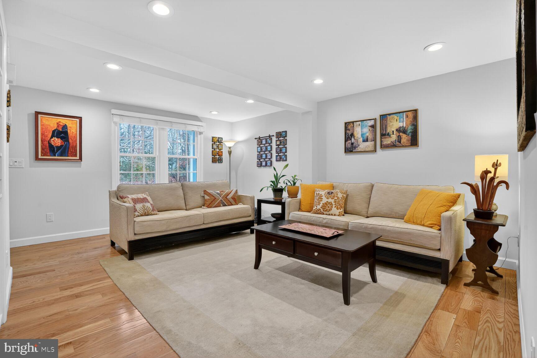 1575 Bennington Woods Court Reston, VA 20194 - Photo 6 of 39 a living room with furniture and a rug