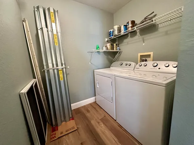 a view of bathroom with washer and dryer