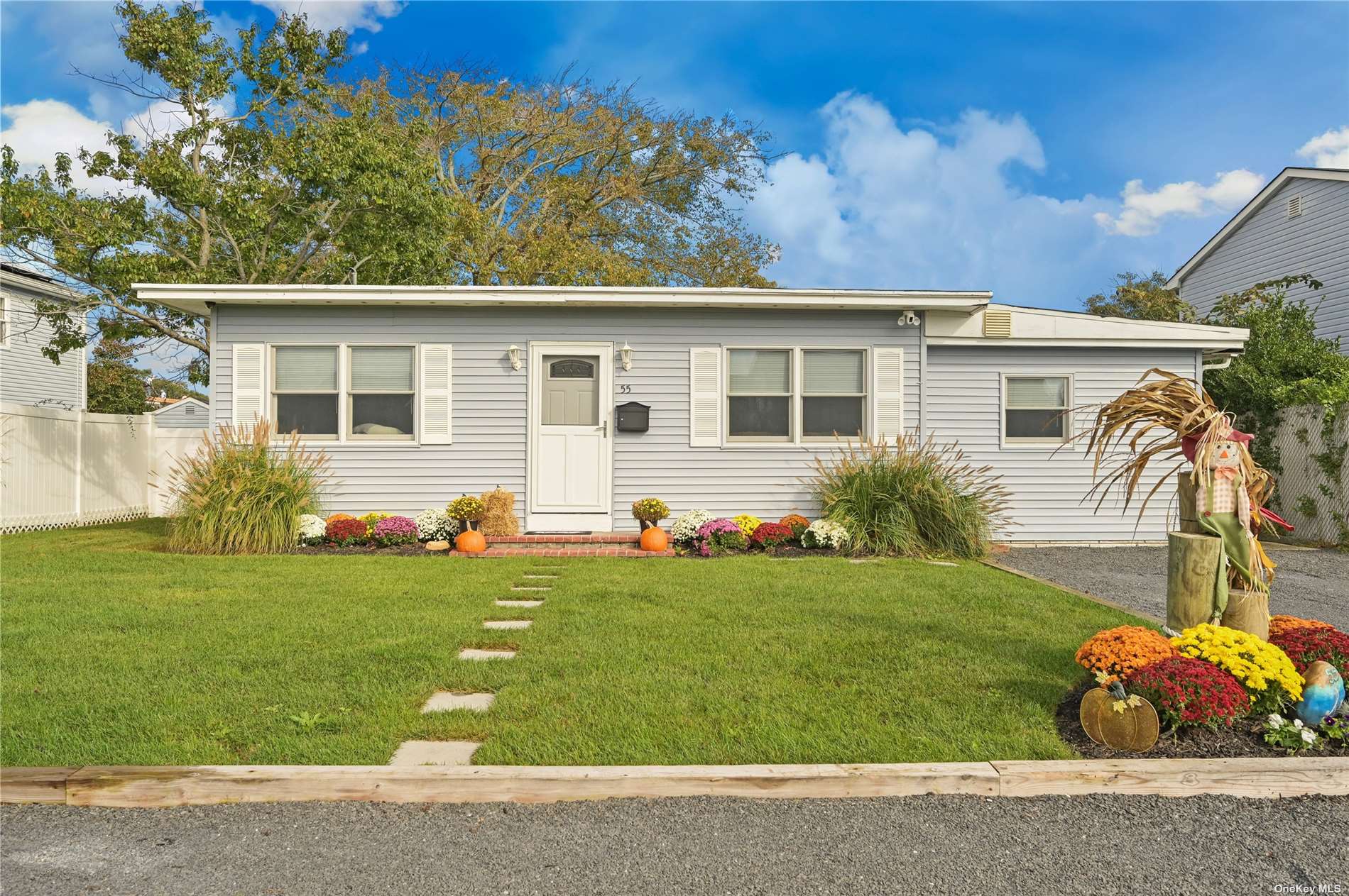 55 Price Street Patchogue, NY 11772 - Photo 1 of 1 a front view of a house with garden