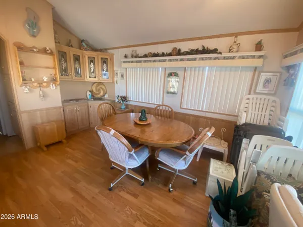 a dining room with furniture and window