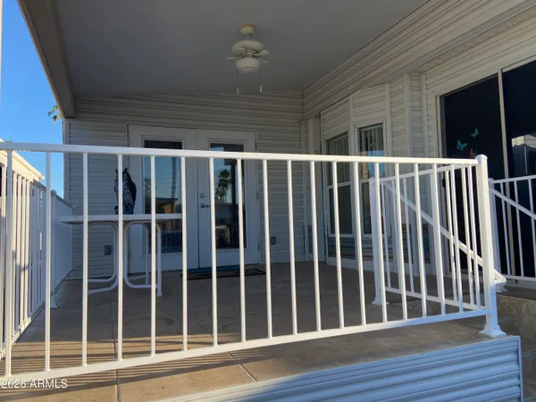 a view of balcony with wooden floor