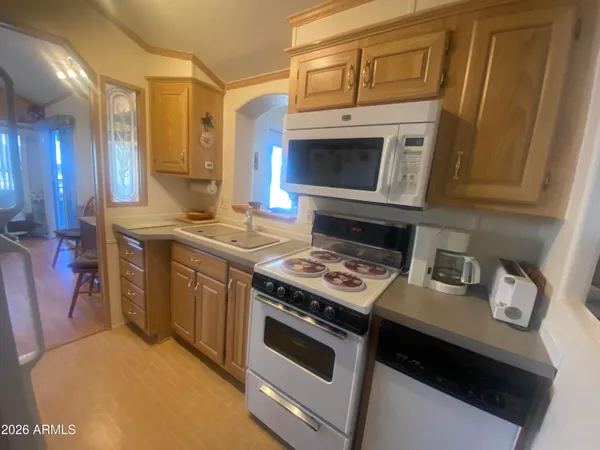 a kitchen with a stove and a microwave