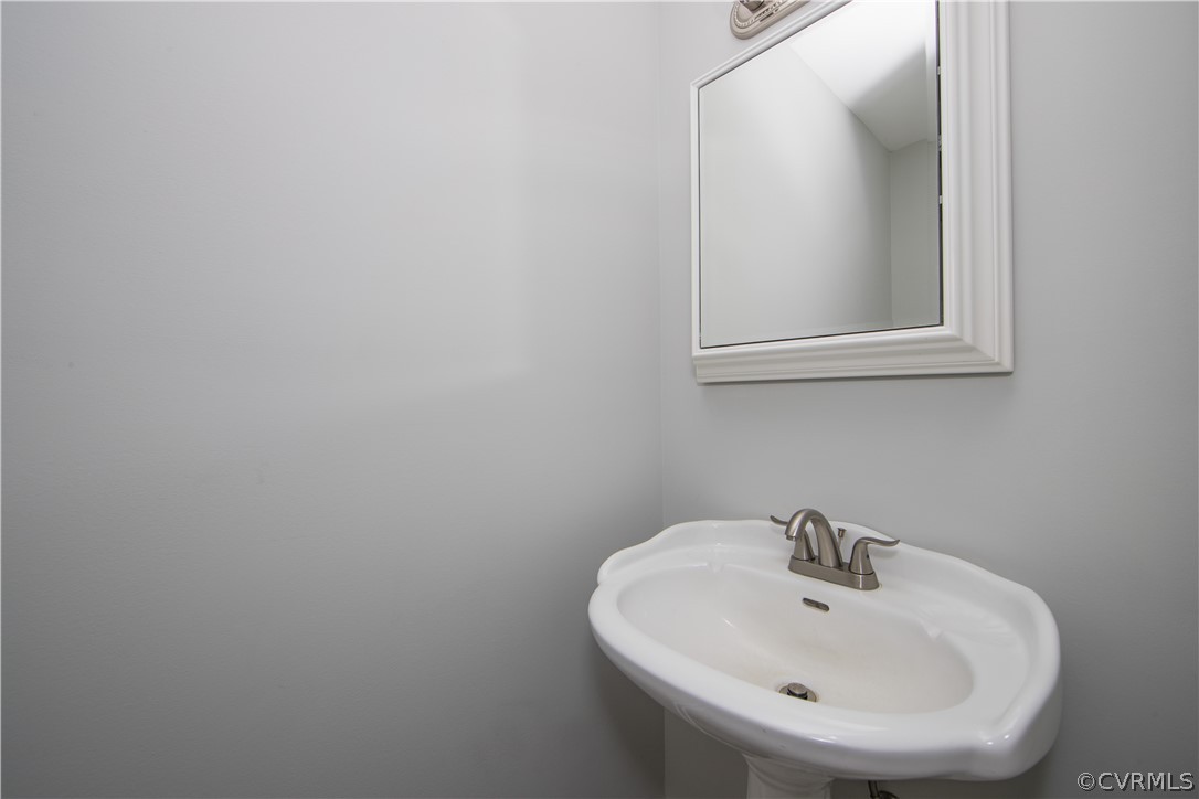 2160 Genito Road Moseley, VA 23120 - Photo 18 of 49 a bathroom with a sink and a mirror