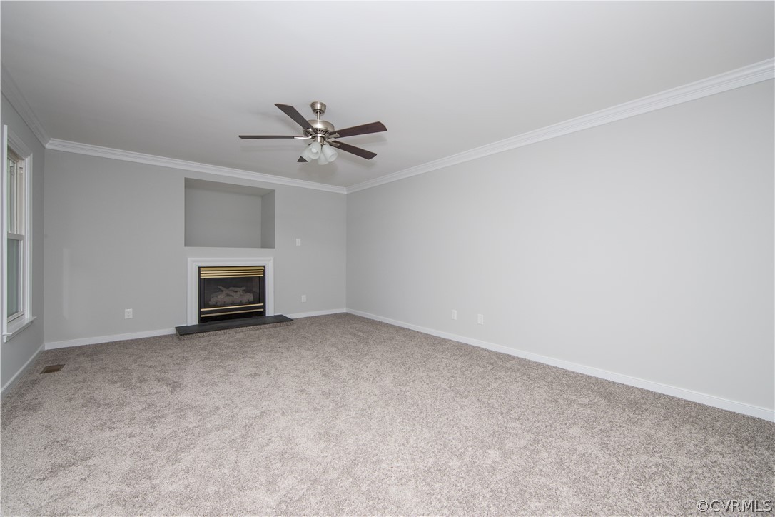 2160 Genito Road Moseley, VA 23120 - Photo 19 of 49 an empty room with a fireplace and fan