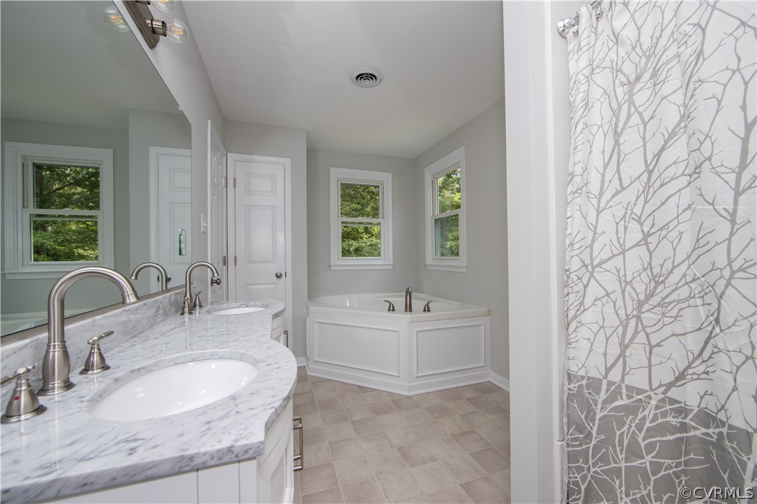 2160 Genito Road Moseley, VA 23120 - Photo 26 of 49 Master bath w/ tile flooring and fixtures
