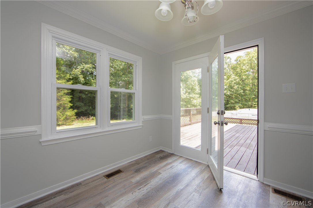 2160 Genito Road Moseley, VA 23120 - Photo 37 of 49 a view of an empty room with wooden floor and a window