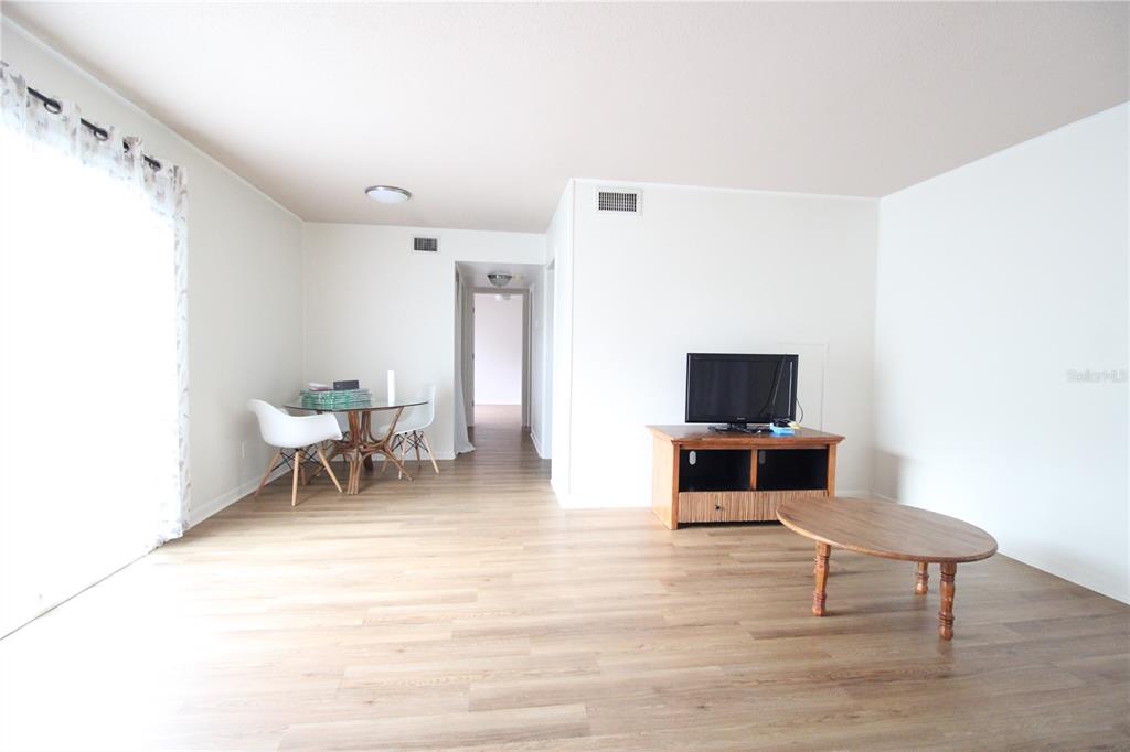507 Northwest 39th Road, Unit 112 Gainesville, FL 32607 - Photo 16 of 23 a living room with furniture and a flat screen tv