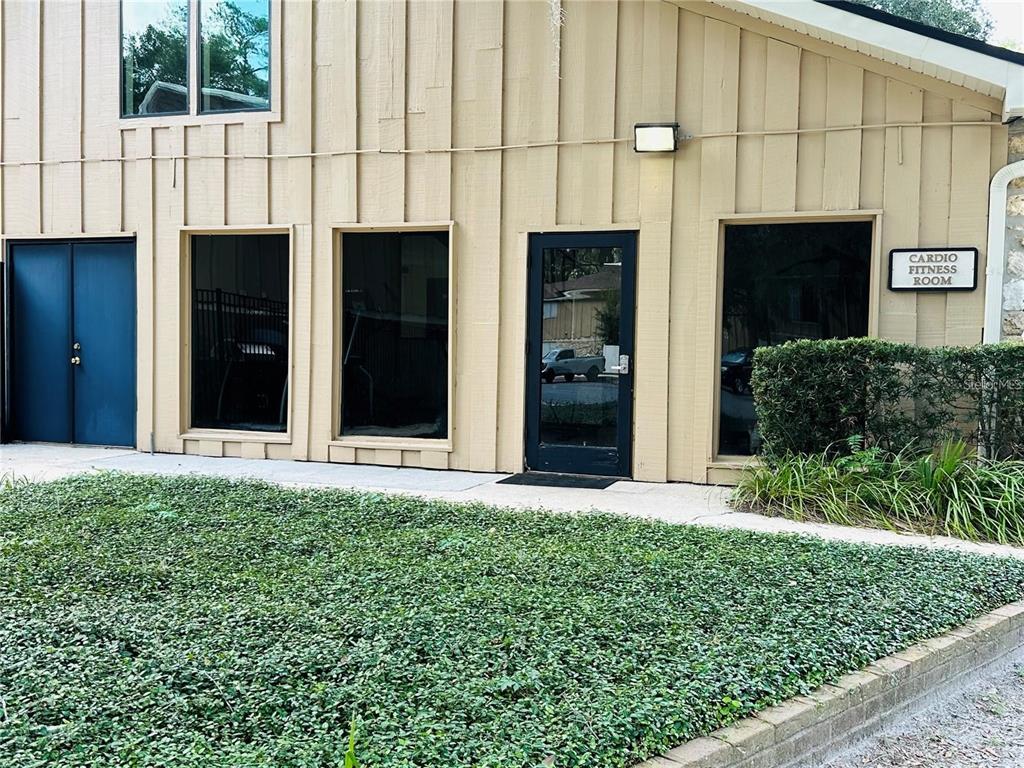 507 Northwest 39th Road, Unit 112 Gainesville, FL 32607 - Photo 20 of 23 a front view of a house with a garden