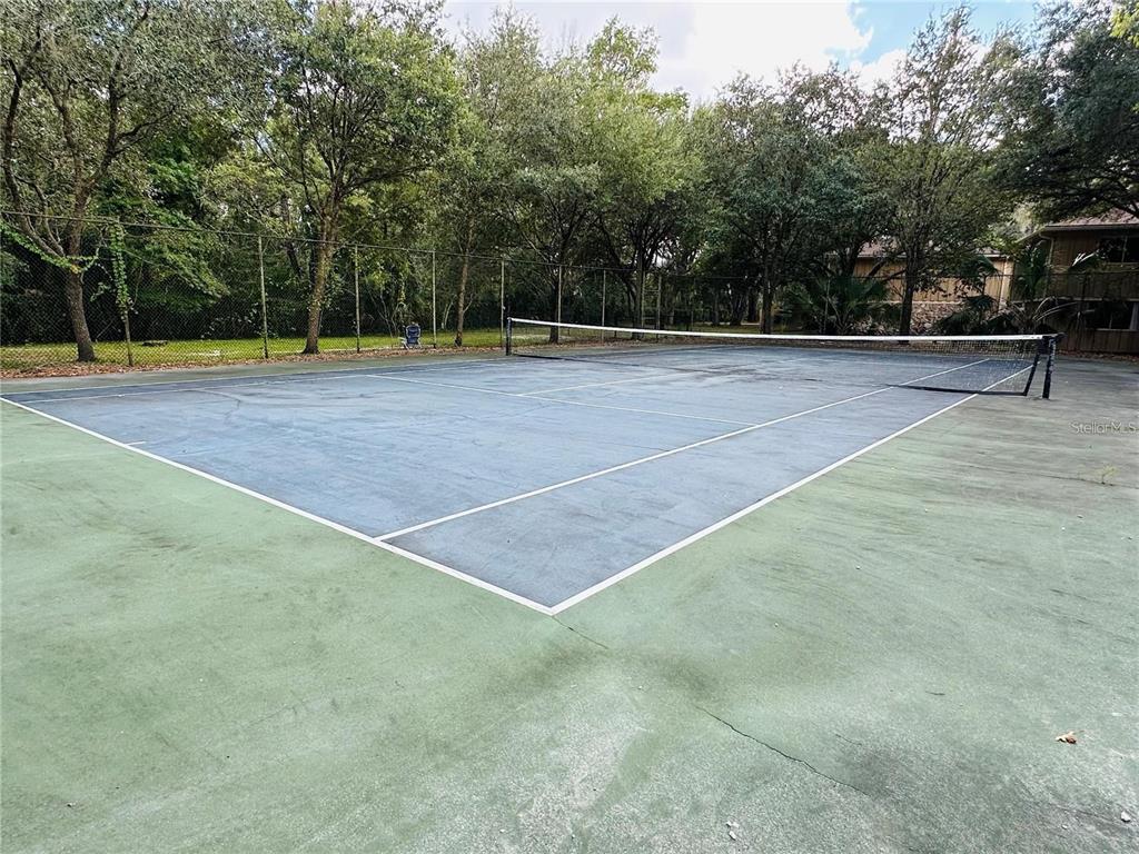 507 Northwest 39th Road, Unit 112 Gainesville, FL 32607 - Photo 23 of 23 a view of outdoor space and tennis court